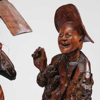 A large well sculptured root sculpture of 'Sholau and attendant', late Qing dynasty, 19th century.