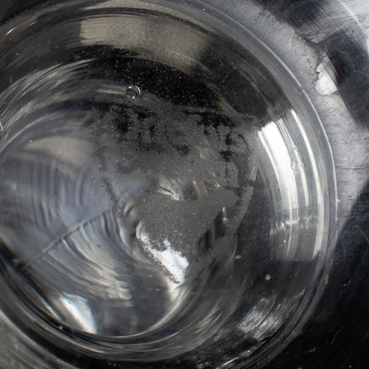 A set of twelve champagne glasses by Simon Gate.