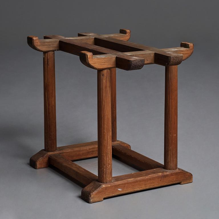 Axel Einar Hjorth, a red limestone top and stained pine side table, Nordiska Kompaniet, Sweden 1929.