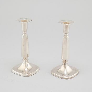 A pair of silver candlesticjs by Tore Eldh for K&EC in Gotheburg, 1970.