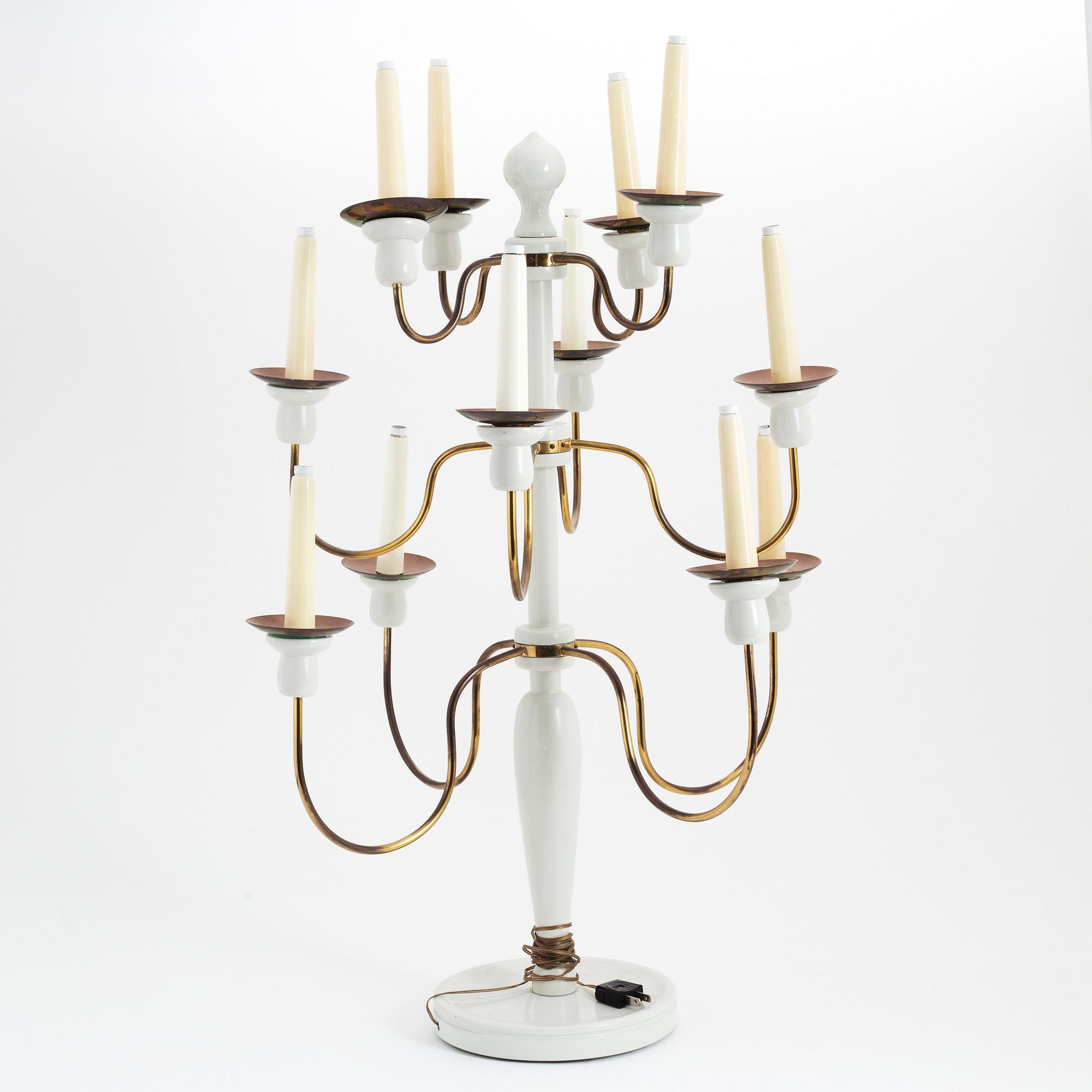 A painted wood and brass model 2586 candelabra by Josef Frank for Firma Svenskt Tenn.