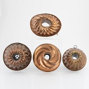 Four copper cake moulds. 18th and 19th Century.