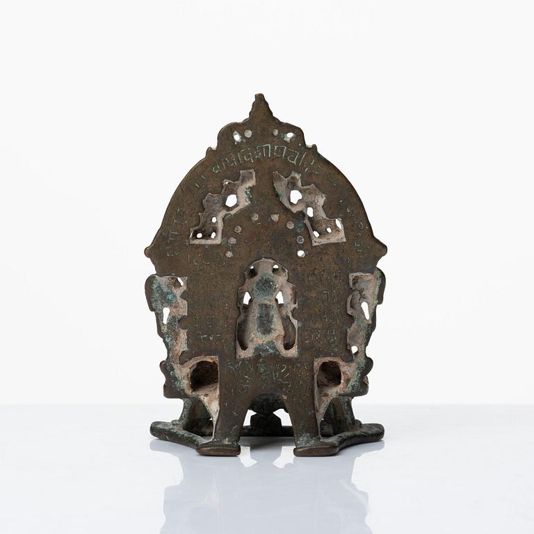 A Jain Shrine, India, copper alloy with silver inlay, 14/15th Century or older.