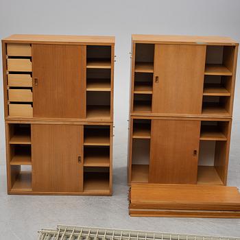 A 'String' teak veneered shelving system by Nils Strinning.