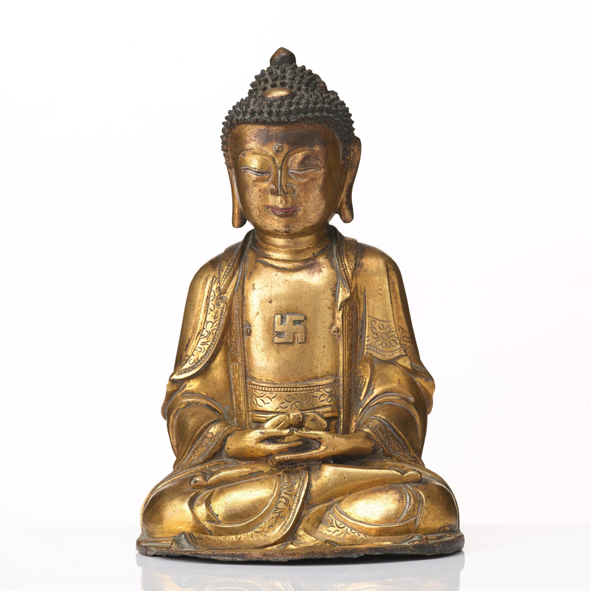 A gilt bronze figure of Amithaba Buddha, Ming dynasty (1368-1644).