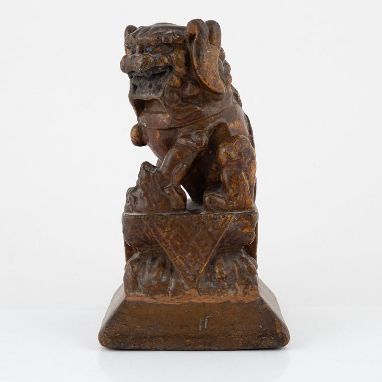A wooden sculpture of a buddhist lion, 19th Century.