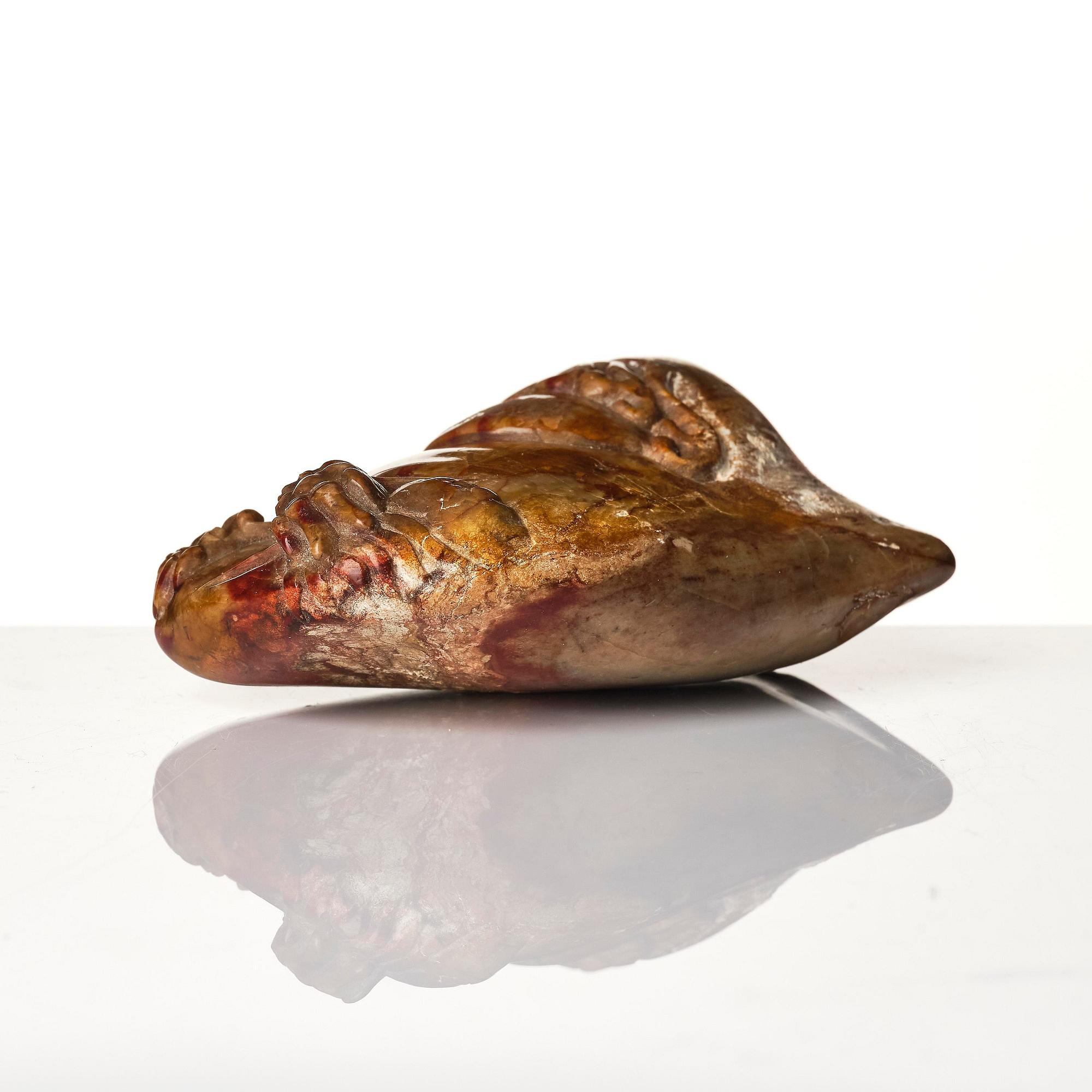 A group of carved nephrite and jade ornaments, China, Qing dynasty and older. (8 pieces).