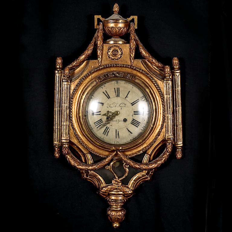 A Gustavian wall hanged clock, dial marked "Jacob Kock Stockholm", maded in the second half of the 18th century.