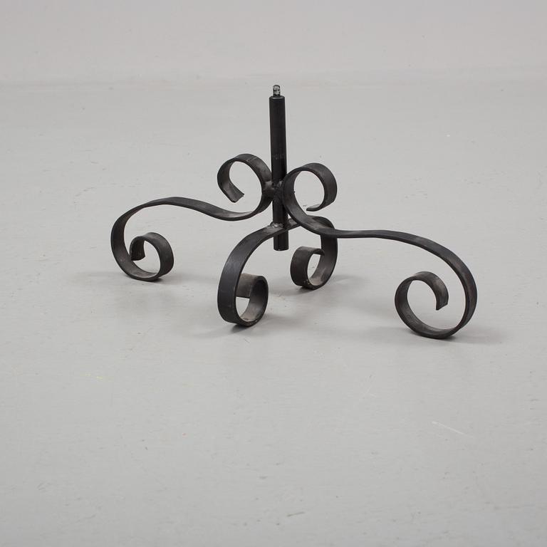 A metal floor candelabra, first half of the 20th century.