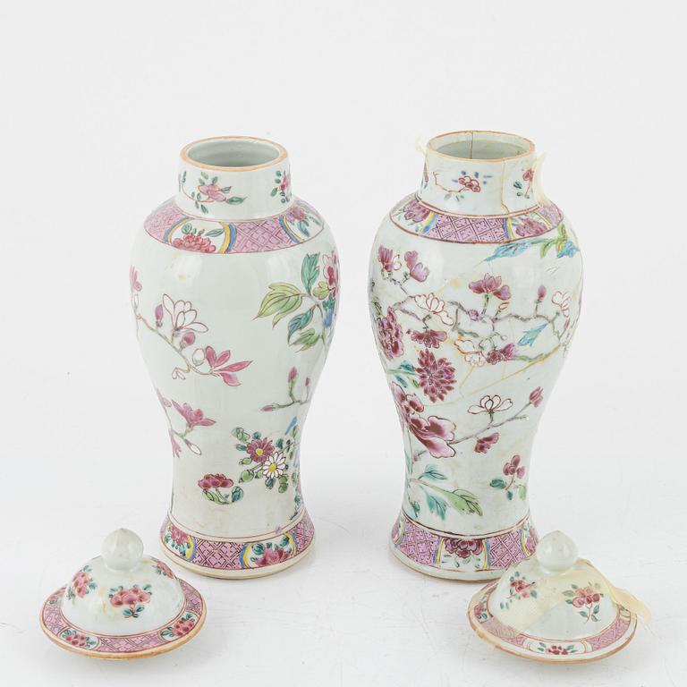 A set of three famille rose vases with covers and a bottle, Qing dynasty, Qianlong (1736-95).