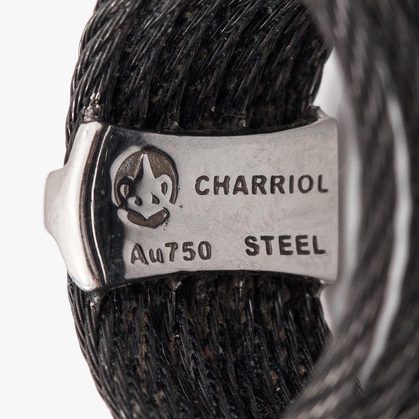An 18K white gold and steel ring with diamonds ca. 0.095 ct in total. Charriol.