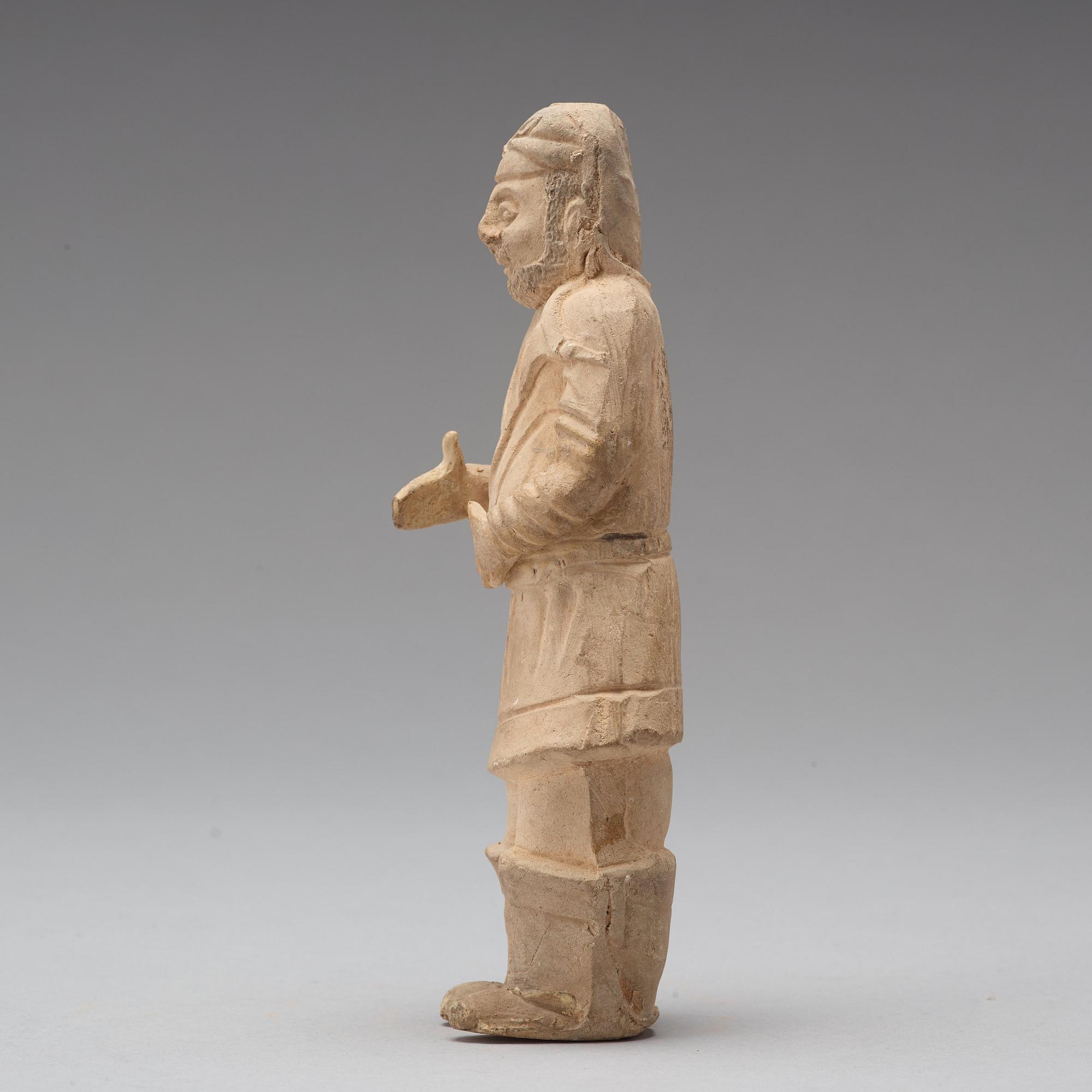 Three pottery scultpures of animals and a herdsman, Tang dynasty (618-906).