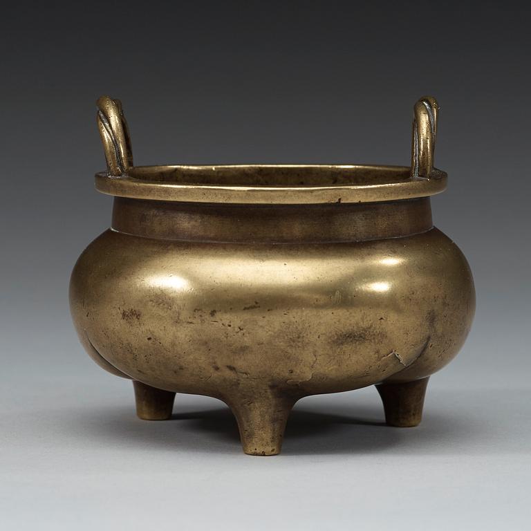 A bronze tripod censer, Qing dynasty, 19th Century.