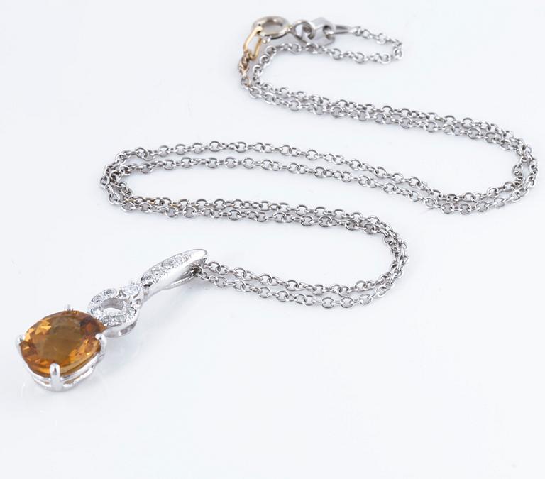 A citrine and brilliant cut diamond pendant.