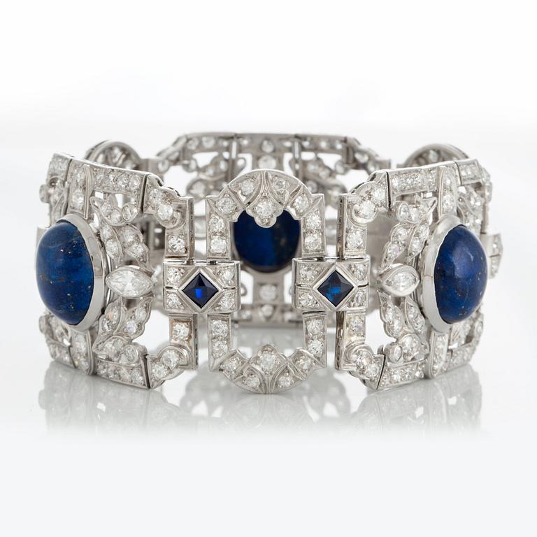 A platinum bracelet set with lapis lazuli, old-cut diamonds with a total weight of ca 10 cts and synthetic sapphires.