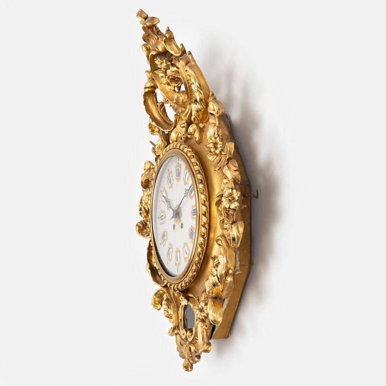 A Rococo style wall clock, first half of the 20th century.
