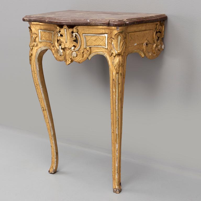 A rococo console table with a stone top, second half of the 18th century.