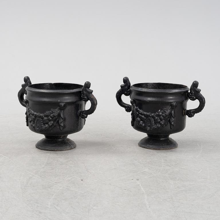 A pair of cast iron urns, Stavsjö Bruk, Sweden.