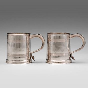 A pair of English early 18th century silver muggs, mark of John Cory, London 1704.