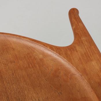 A Hans J Wegner 'Jakkens Hvile' teak chair, Johannes Hansen, Denmark.