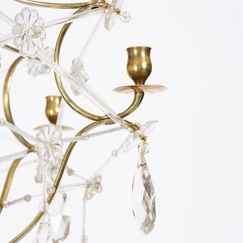 A seven-light gilt brass and cut glass rococo chandelier, mid 18th century.