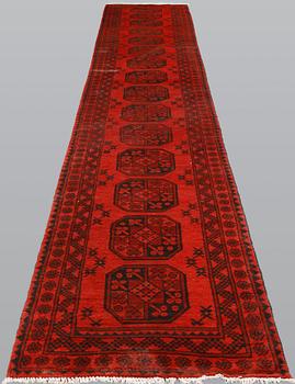 AnAfghan runner, ca 575 x 78 cm.