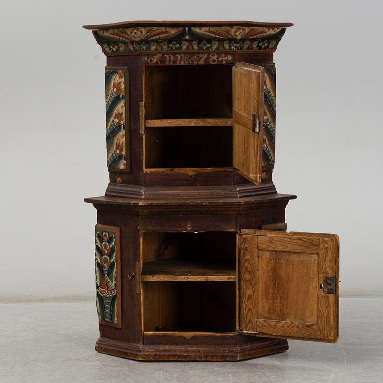 A Swedish corner cabinet dated 1784.