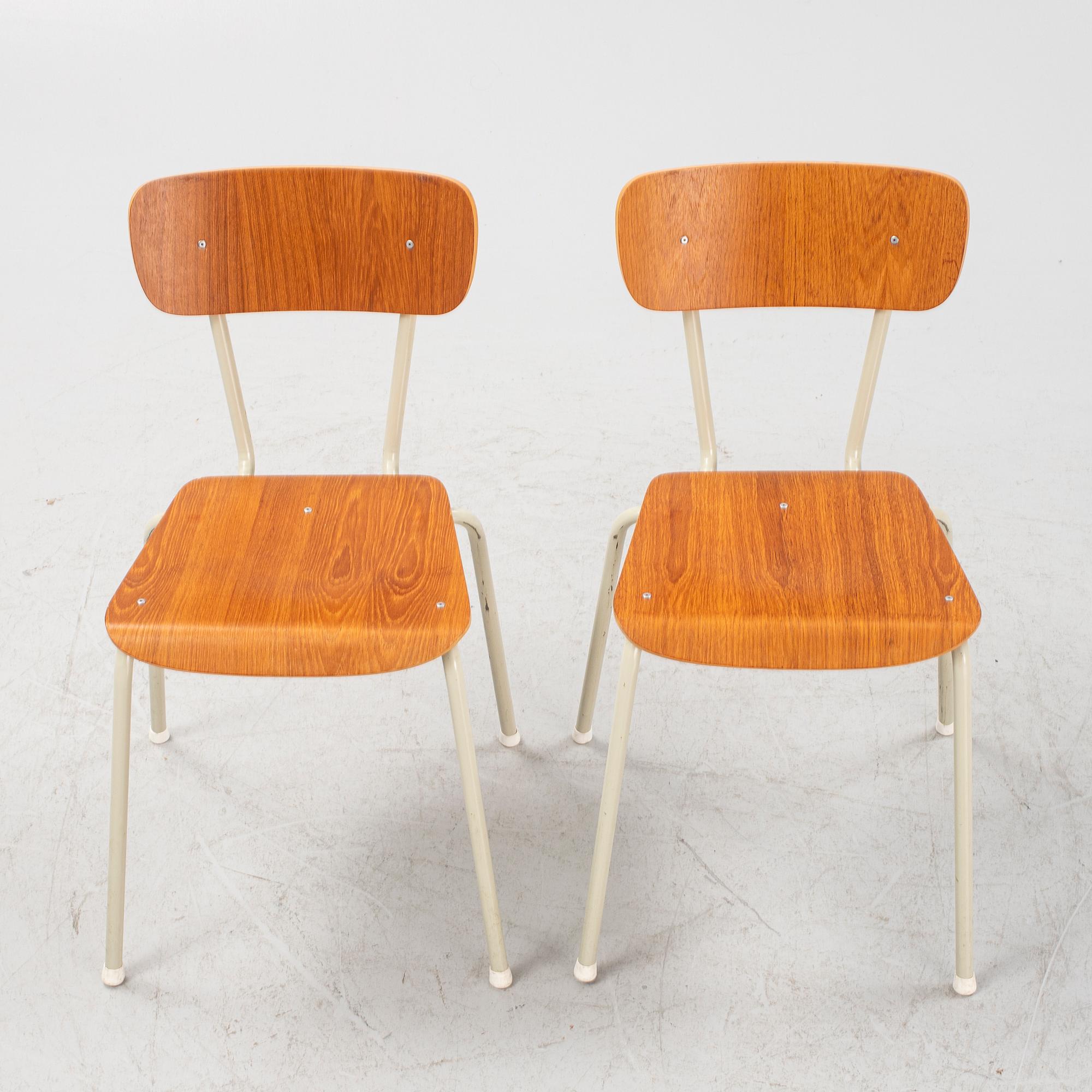 Eight teak veneered chairs, second part of the 20th Century.