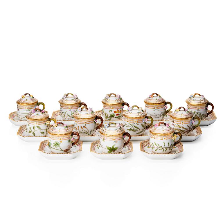 A set of 12 Royal Copenhagen 'Flora Danica' custard cups with covers and stand, Denmark, 20th Century.