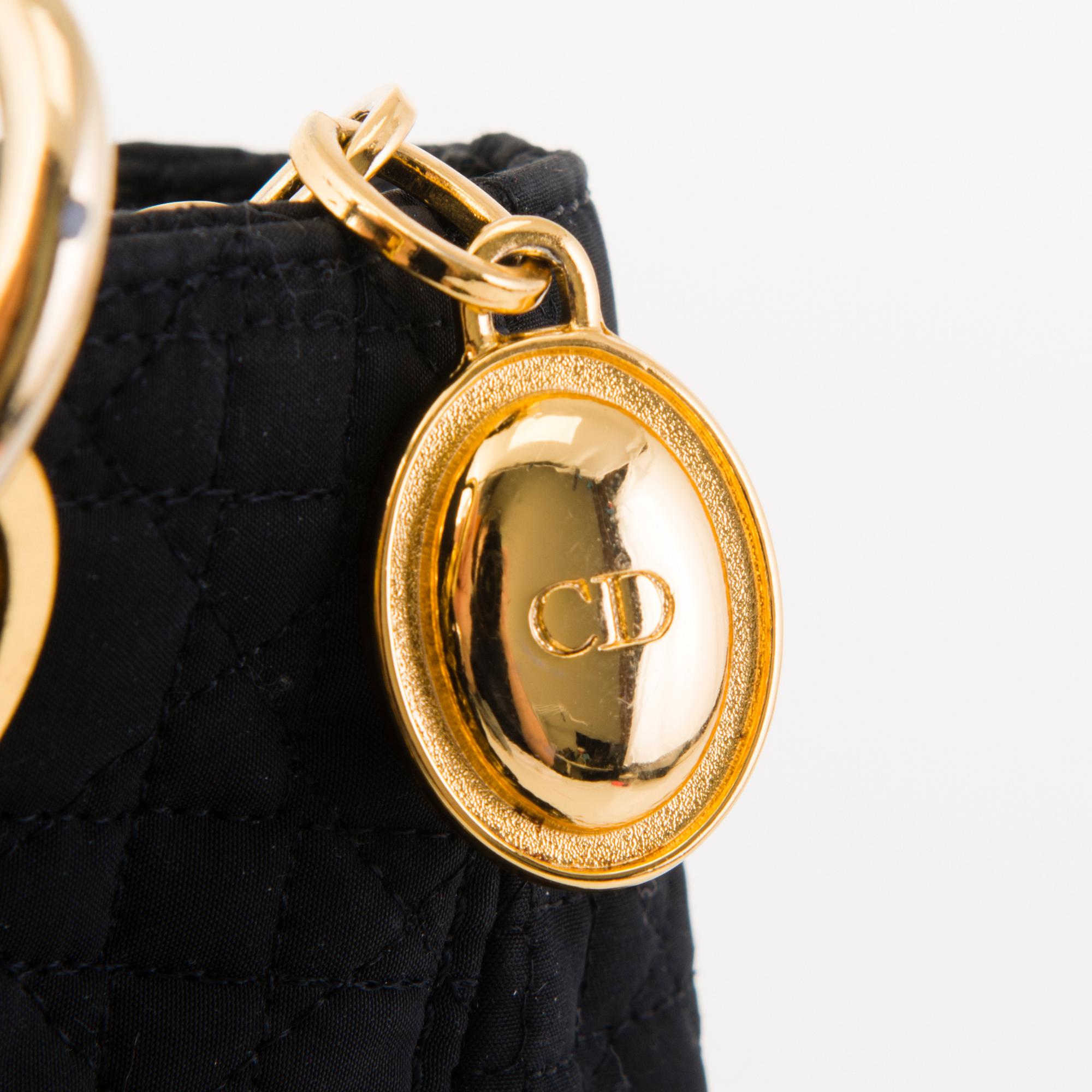 CHRISTIAN DIOR Lady Dior Handbag and Two Pairs of Tribal Earrings.