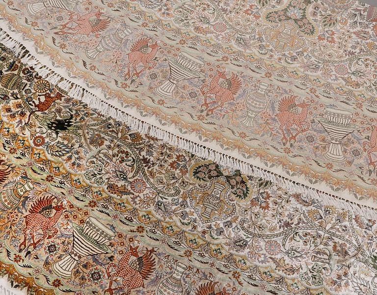 An oval pictoral silk carpet, ca 273 x 180 cm.
