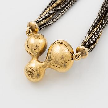Ole Lynggard lås 18K guld med akvamariner och en rund briljantslipad diamant, design Charlotte Lynggard.