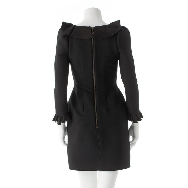 LANVIN, a black wool blend dress with ruffles.