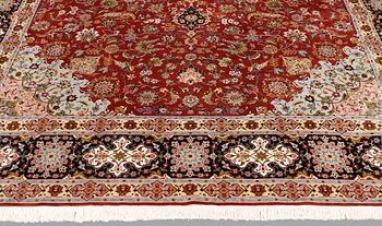 A Tabriz carpet, part silk, so-called 50 Raj, approx. 352 x 250 cm.