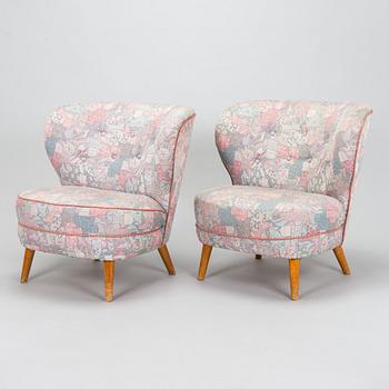 A pair of mid-20th century armchairs.