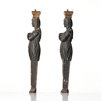 A pair of late Gustavian carved caryatids in the manner of Pehr Ljung (1743-1819) and Ernst Philip Thomann (1760-1833).