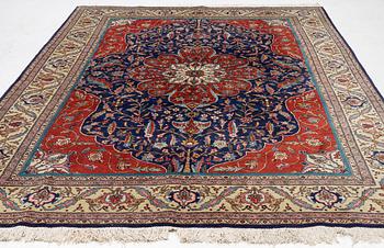 A semi-antique Tabriz, c. 349 x 249 cm.