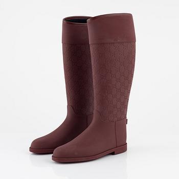 Gucci, a pair of burgundy rubber boots, Italian size 37.