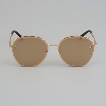 Sunglasses by Chanel.