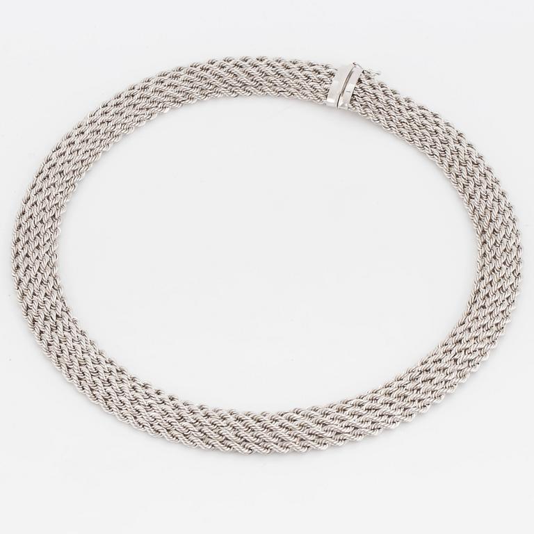 A necklace comprising five strands of French rope link chains.