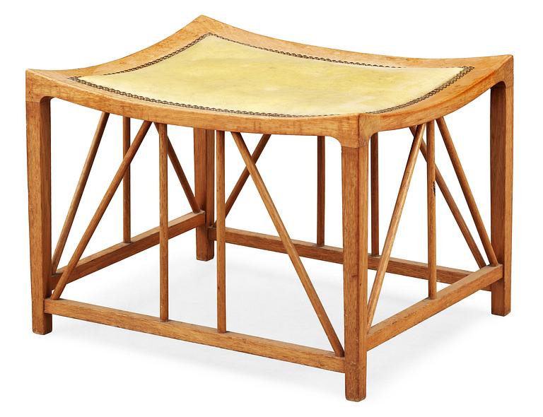 A Josef Frank so called 'Tutanchamon' mahogny and leather stool by Svenskt Tenn.