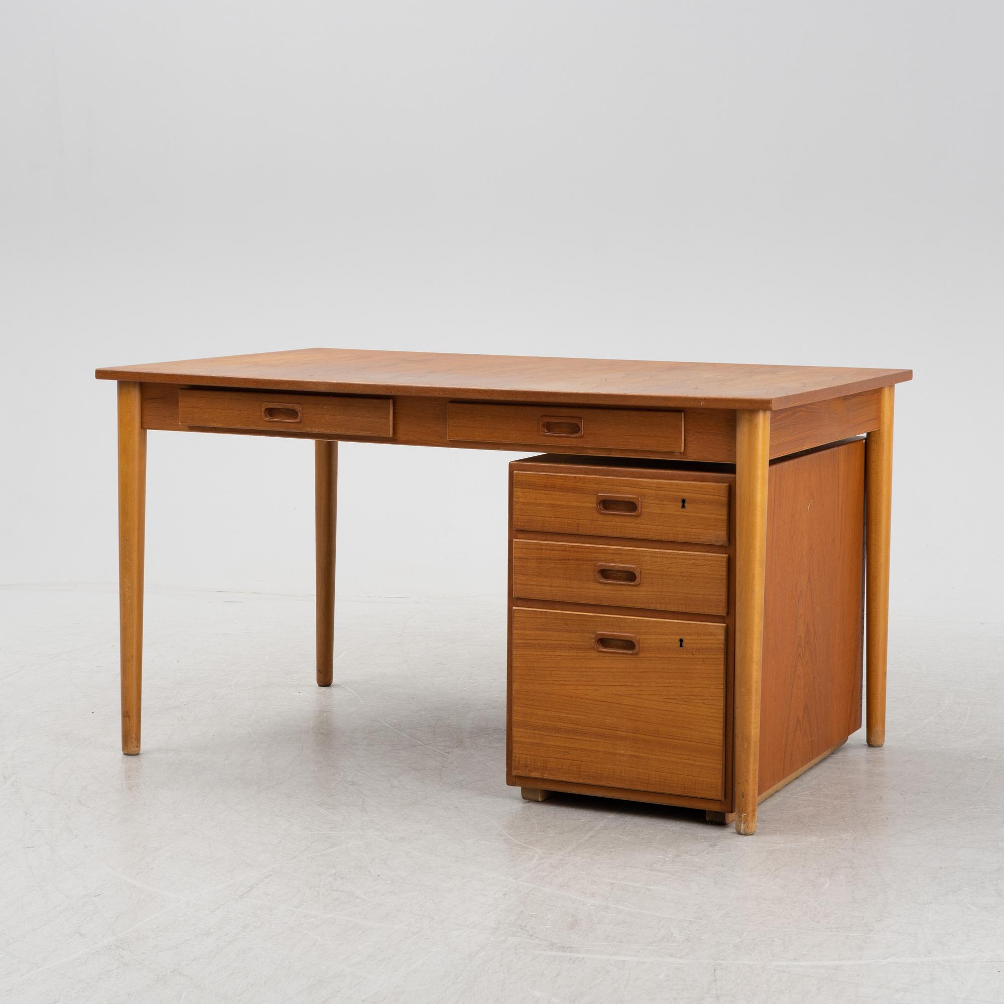 A desk with a drawer unit, Bra Bohag, Hugo Troeds, Bjärnu, mid 20th Century.