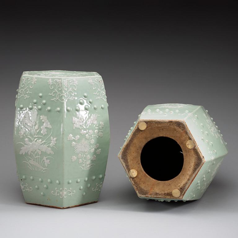 A pair of slip decorated celadon garden seats, Qing dynasty 19th century.
