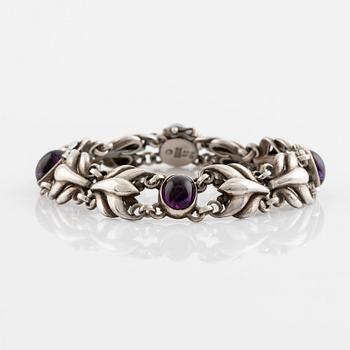 Georg Jensen, a silver bracelet set with cabochon-cut amethysts.