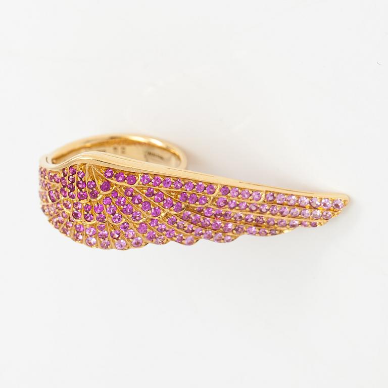 Garrard, An 18K gold ring "Wings" with rubies. Marked Garrard 52 Austria.