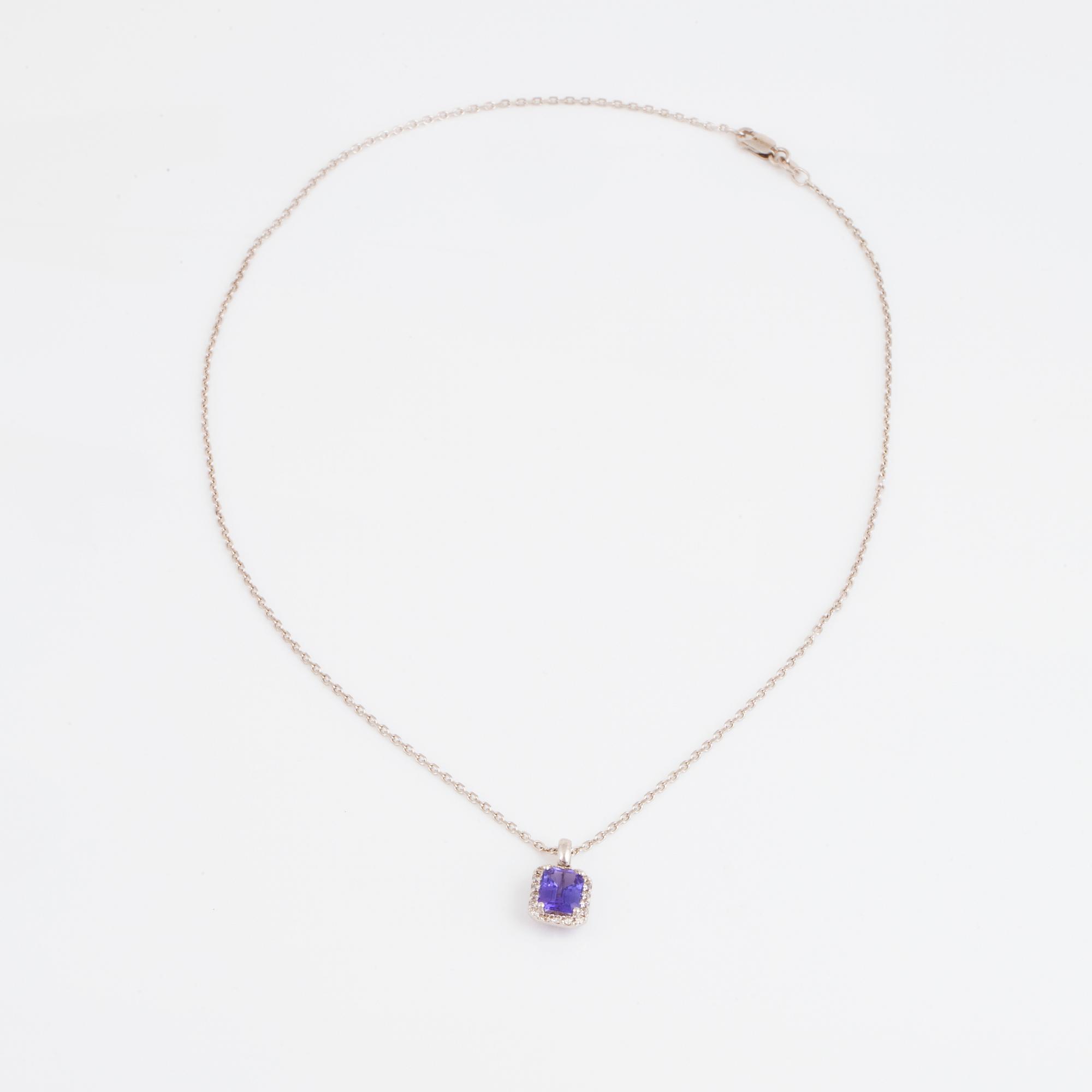 An 18K white gold necklace set with a faceted tanzanite.