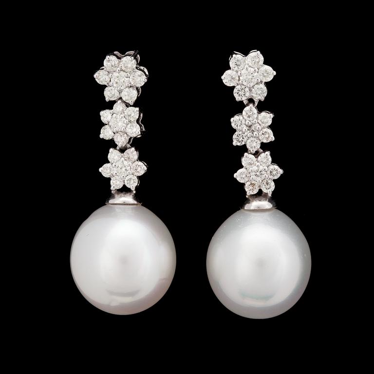 A pair of cultured South sea pearl and diamond earrings, tot. 1.47 cts.