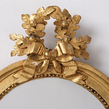 A pair of Gustavian giltwood two-branch girandole mirrors by J. Åkerblad (master in Stockholm 1758-99).