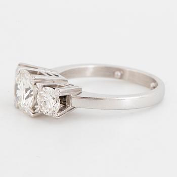 Brilliant-cut diamond  three-stone ring.