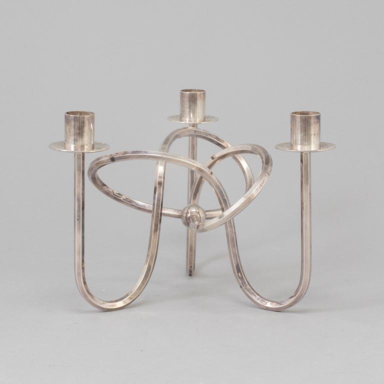 Josef Frank, a silver platen "Vänskapsknuten" candelabra ju Josef Frank för Firma Svenskt Tenn.